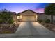 Charming single-story home with a well-maintained front yard and a two-car garage at 7817 Homing Pigeon St, North Las Vegas, NV 89084