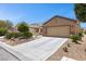 Lovely single-story home with a well-kept yard, mature trees, and a spacious two-car garage at 7817 Homing Pigeon St, North Las Vegas, NV 89084