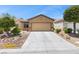 Inviting single-Gathering home featuring desert landscaping, and a spacious two-car garage at 7817 Homing Pigeon St, North Las Vegas, NV 89084