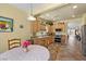 Open kitchen featuring stainless appliances, tile floors, and a breakfast nook at 7817 Homing Pigeon St, North Las Vegas, NV 89084