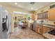 Spacious kitchen with stainless appliances and breakfast nook at 7817 Homing Pigeon St, North Las Vegas, NV 89084