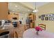 Bright kitchen with stainless appliances, granite countertops, and breakfast nook area at 7817 Homing Pigeon St, North Las Vegas, NV 89084
