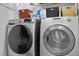 Laundry room with front load washer and dryer at 7817 Homing Pigeon St, North Las Vegas, NV 89084