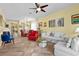 Bright living room with tile flooring, comfortable seating, and an open layout at 7817 Homing Pigeon St, North Las Vegas, NV 89084