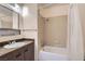 Cozy bathroom with a single vanity, and shower-tub combination at 7898 Wishing Well Rd, Las Vegas, NV 89123