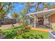 Beautiful backyard features patio area, shed, artificial lawn, and shade trees with a fully fenced yard at 8509 Lansdale Rd, Las Vegas, NV 89123