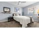 Comfortable bedroom with a queen bed, neutral tones, and wall decor at 8509 Lansdale Rd, Las Vegas, NV 89123