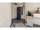 Welcoming front porch with decorative planters and a secure front door at 8509 Lansdale Rd, Las Vegas, NV 89123