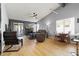 Bright living room featuring a fireplace, vaulted ceilings, and stylish furnishings at 8509 Lansdale Rd, Las Vegas, NV 89123