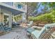 Inviting backyard oasis featuring a fire pit, patio seating, and lush landscaping at 8713 Nautical Bay Ln, Las Vegas, NV 89117