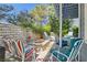 Relaxing backyard with a fire pit, comfortable seating, and a lovely patio setting at 8713 Nautical Bay Ln, Las Vegas, NV 89117