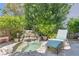 Secluded backyard featuring a soothing waterfall, a rock-lined pond, and verdant greenery at 8713 Nautical Bay Ln, Las Vegas, NV 89117