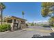 Secure gated community entrance with guard house, mature trees, and lush landscaping at 8713 Nautical Bay Ln, Las Vegas, NV 89117