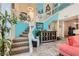 Inviting foyer with staircase, tiled floors, and stylish decor at 8713 Nautical Bay Ln, Las Vegas, NV 89117