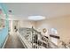 Bright hallway with skylight above and an overview of the living area below at 8713 Nautical Bay Ln, Las Vegas, NV 89117