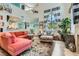 Open living room with a large window, fireplace, and comfortable seating at 8713 Nautical Bay Ln, Las Vegas, NV 89117
