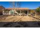 Home featuring an extended covered patio, desert landscaping, and privacy, perfect for relaxation and entertaining at 9077 Creed Mountain Pl, Las Vegas, NV 89178