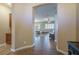 A spacious living room with tile flooring, an archway to a light-filled room, and neutral color palette at 9077 Creed Mountain Pl, Las Vegas, NV 89178