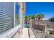 Balcony with a pool view, a metal railing, and a view of several palm trees at 10062 Aspen Rose St # 103, Las Vegas, NV 89183