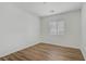 Bright, minimalist bedroom with vinyl floors and ample natural light at 10062 Aspen Rose St # 103, Las Vegas, NV 89183