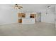 Spacious living room featuring tile flooring, recessed lighting, and open kitchen area at 10062 Aspen Rose St # 103, Las Vegas, NV 89183