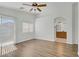 Open and airy main bedroom featuring wood-look floors and a view to the bathroom at 10062 Aspen Rose St # 103, Las Vegas, NV 89183