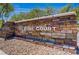 Welcome to St Rose Court stone community sign with desert landscaping at 10062 Aspen Rose St # 103, Las Vegas, NV 89183