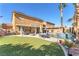 Expansive backyard with pool, spa, and patio area, offering ample space for outdoor activities at 10654 Sidlaw Hills Ct, Las Vegas, NV 89141