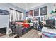 This bedroom has a twin-sized bed with a home office setup with a large window at 10654 Sidlaw Hills Ct, Las Vegas, NV 89141