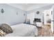 Charming bedroom with a comfortable bed, closet, and blue accent wall at 10654 Sidlaw Hills Ct, Las Vegas, NV 89141
