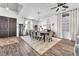 Spacious dining area with a large table, stylish decor, and ample natural light, perfect for Gathering gatherings at 10654 Sidlaw Hills Ct, Las Vegas, NV 89141