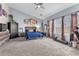 Bright main bedroom with carpet, large windows, and ample natural light at 10654 Sidlaw Hills Ct, Las Vegas, NV 89141