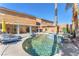 Backyard pool with spa, surrounded by a concrete patio and lush landscaping at 10654 Sidlaw Hills Ct, Las Vegas, NV 89141