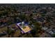 Aerial view of a property with sand-filled backyard, a small patch of artificial grass, and lush trees in a residential area at 1411 Norman Ave, Las Vegas, NV 89104