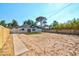 The spacious backyard features a small patch of artificial turf and a wooden fence, offering potential for customization at 1411 Norman Ave, Las Vegas, NV 89104