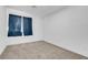 The bedroom has carpet and window bringing in natural light. Create your sanctuary in this room at 1411 Norman Ave, Las Vegas, NV 89104