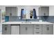 Modern kitchen featuring gray cabinetry, stainless steel appliances, and white countertops at 1411 Norman Ave, Las Vegas, NV 89104