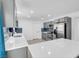 Modern kitchen with white countertops, stainless steel appliances, and stylish gray cabinets at 1411 Norman Ave, Las Vegas, NV 89104