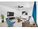 Spacious living room features large TV, comfortable seating, and bright natural light at 1411 Norman Ave, Las Vegas, NV 89104