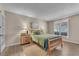 Cozy bedroom with natural light, wood-look floors, and a neutral color scheme at 1468 Harmony Hill Dr, Henderson, NV 89014