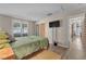 Bedroom featuring wood-look floors, a mounted TV and neutral walls at 1468 Harmony Hill Dr, Henderson, NV 89014