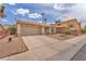 Charming single story home with desert landscaping and a two car garage at 1468 Harmony Hill Dr, Henderson, NV 89014