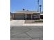 Inviting single-story home with a cozy front yard and a convenient two-car garage and mature palm trees at 1468 Harmony Hill Dr, Henderson, NV 89014