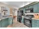 Classic kitchen featuring updated appliances and ample cabinet space at 1468 Harmony Hill Dr, Henderson, NV 89014