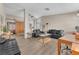 Spacious living room with wood laminate flooring, lots of natural light, and modern decor at 1468 Harmony Hill Dr, Henderson, NV 89014