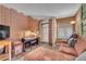 Comfortable living room featuring exposed brick wall and modern fixtures at 1468 Harmony Hill Dr, Henderson, NV 89014