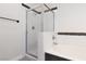 Bathroom featuring a shower with glass doors and a soaking tub at 1609 Hills Of Red Dr # 104, Las Vegas, NV 89128