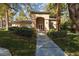 Well-maintained clubhouse featuring lush landscaping and covered entry at 1609 Hills Of Red Dr # 104, Las Vegas, NV 89128
