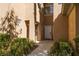 Inviting front entrance with well-manicured landscaping and a cozy feel at 1609 Hills Of Red Dr # 104, Las Vegas, NV 89128