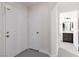 Hallway with tile flooring leading to a bathroom and other rooms at 1609 Hills Of Red Dr # 104, Las Vegas, NV 89128